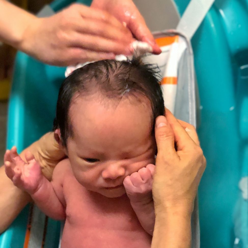 A photo of Coaca Bean taking his first bath.