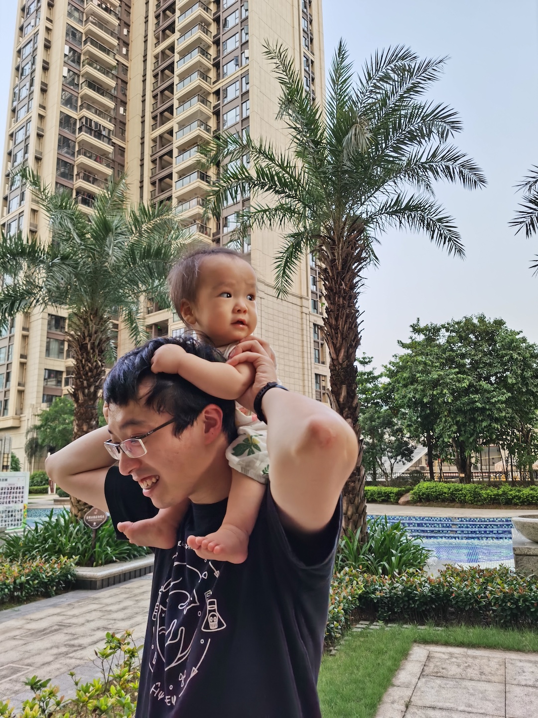 Cocoa Bean is riding on Daddy's neck.