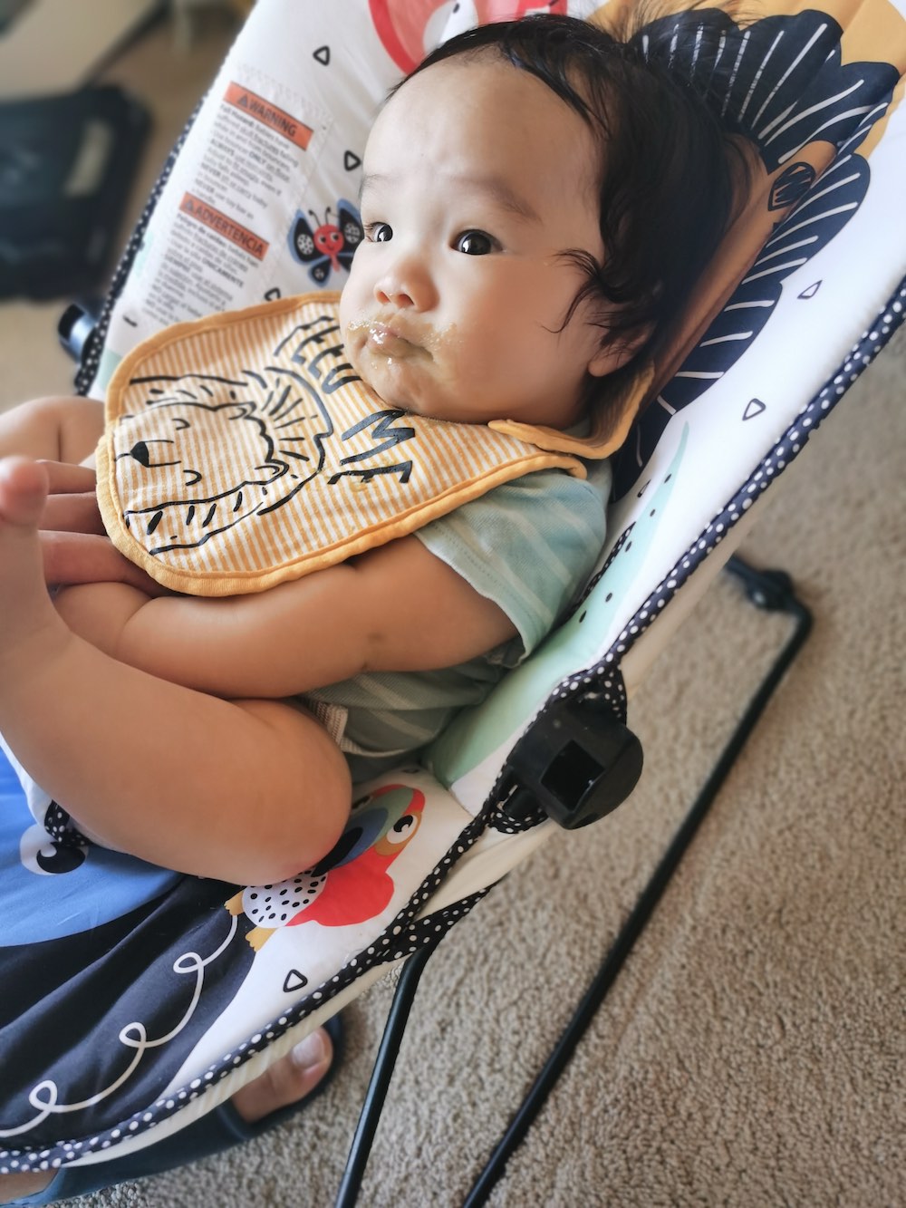 A photo of Coaca Bean after eating veggie puree.