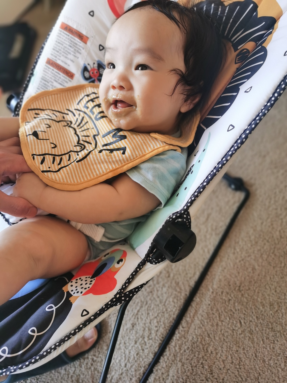 A photo of Coaca Bean after eating veggie puree.