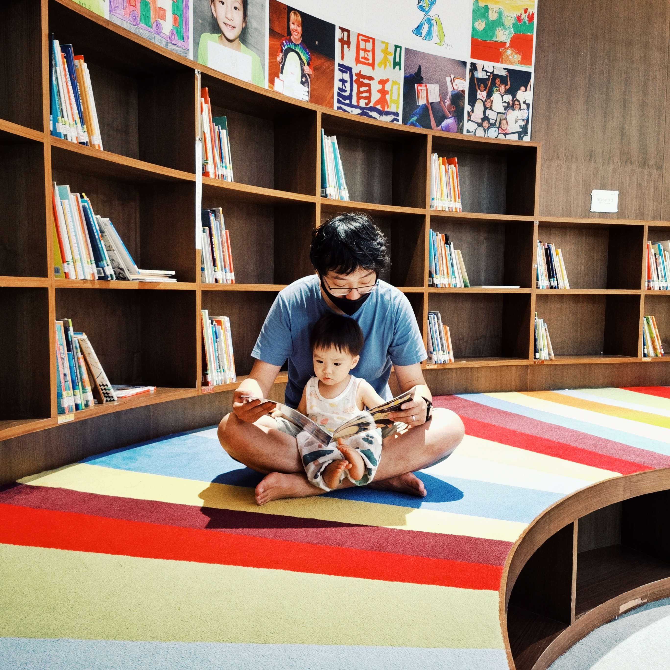 Cocoa Bean is reading with Daddy.