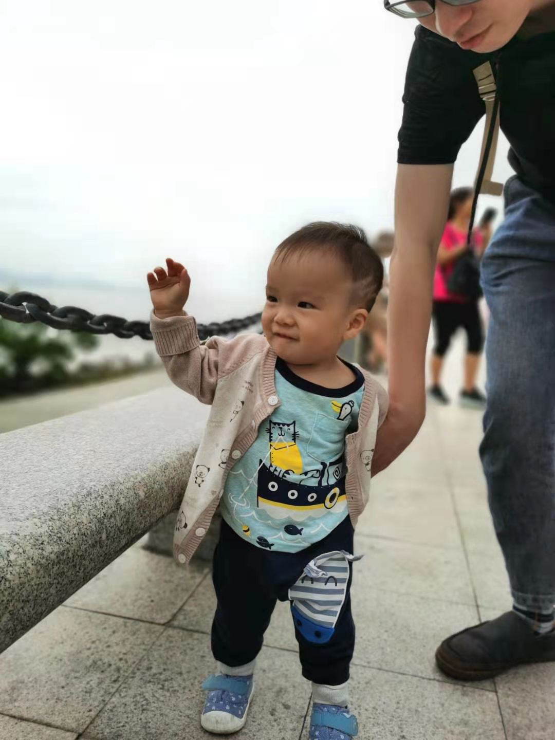 Coaca Bean is taking a stroll in a park.