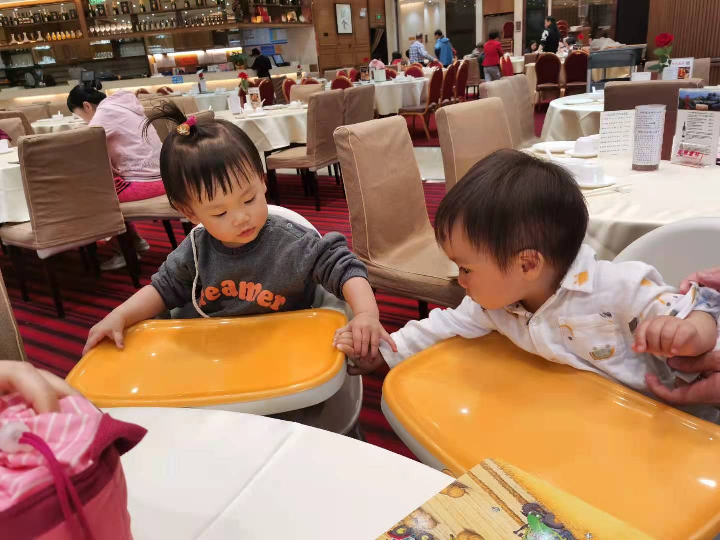 Cocoa Bean is playing with a baby girl.