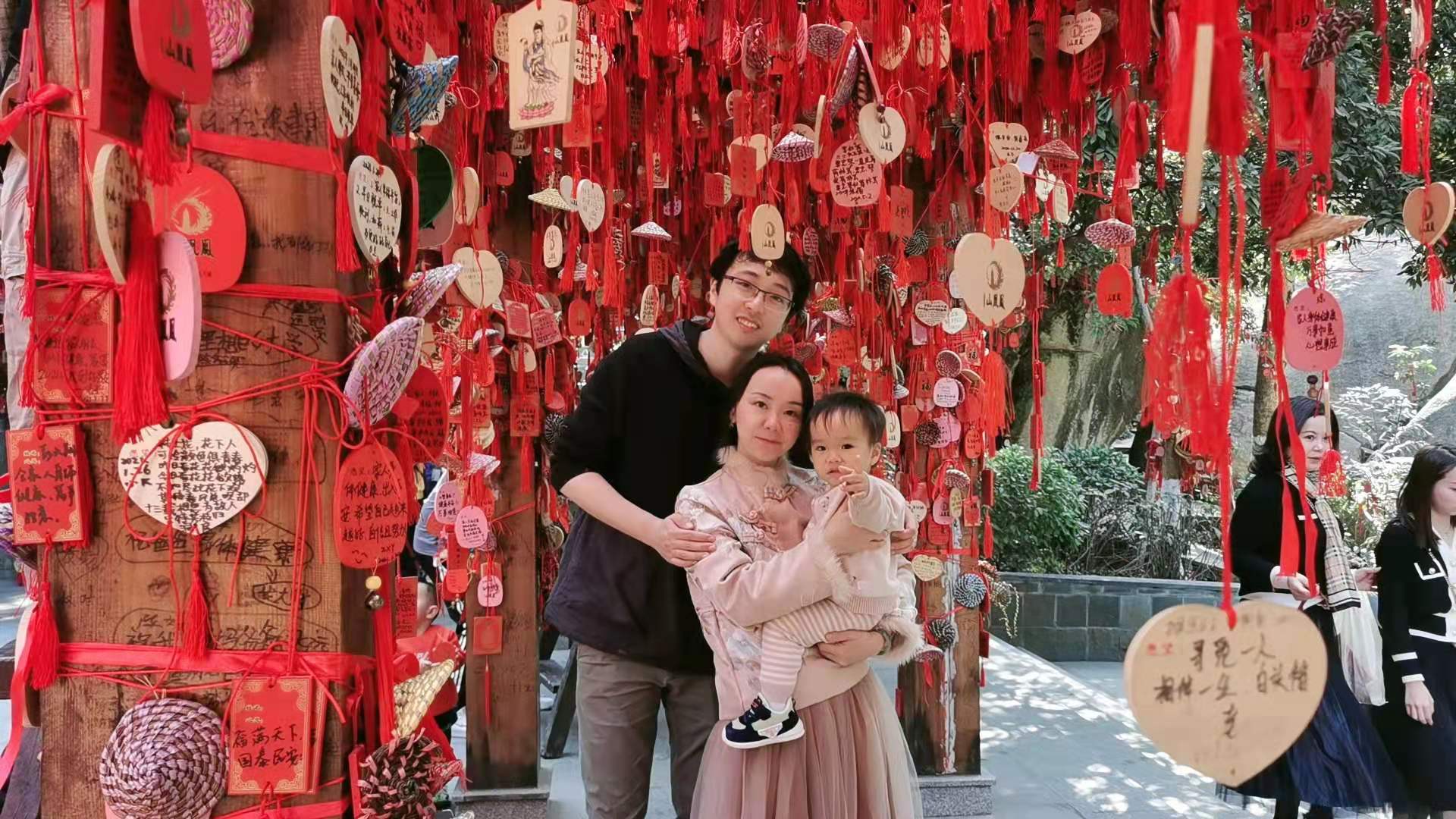 Cocoa Bean and his parents under the wishing tree.