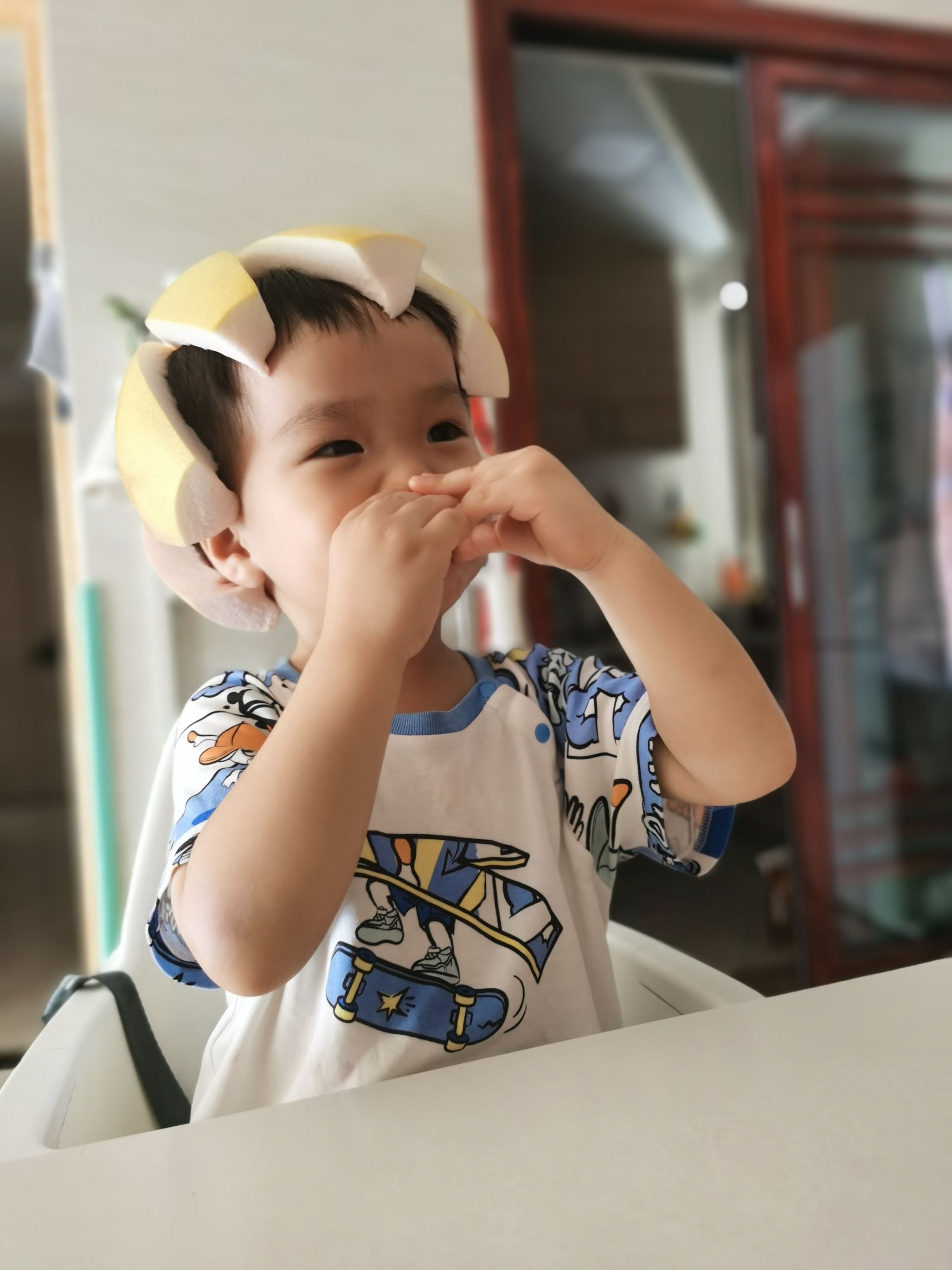 Cocoa Bean is wearing a grapefruit hat.