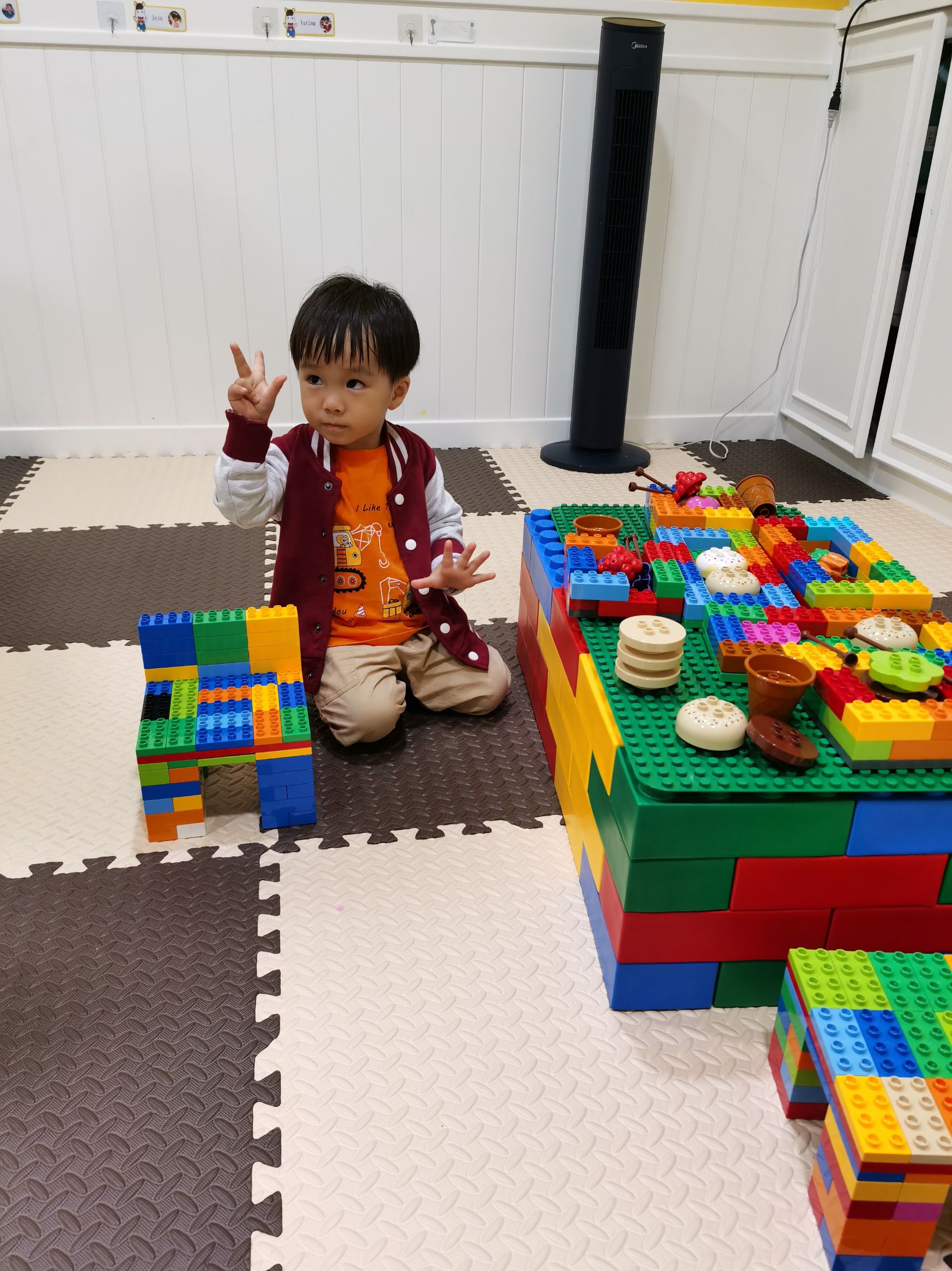 Cocoa Bean is playing with lego.